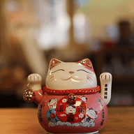 Keramik-Winkekatze mit beweglicher Hand – Rosa auf Kissen (Batterie nicht enthalten)